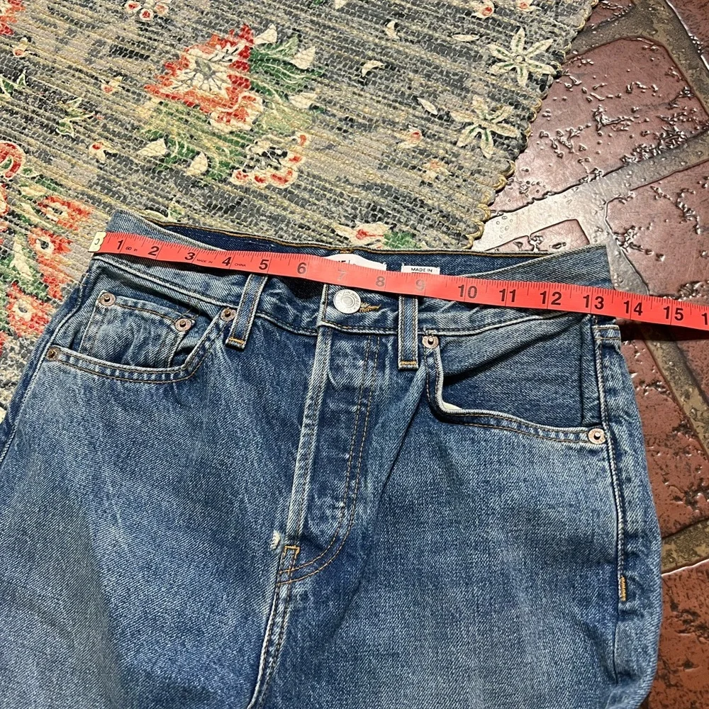 Re Done high rise stove pipe raw frayed hem denim jeans